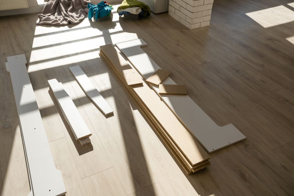 Wooden furniture that is laying flat disassembled